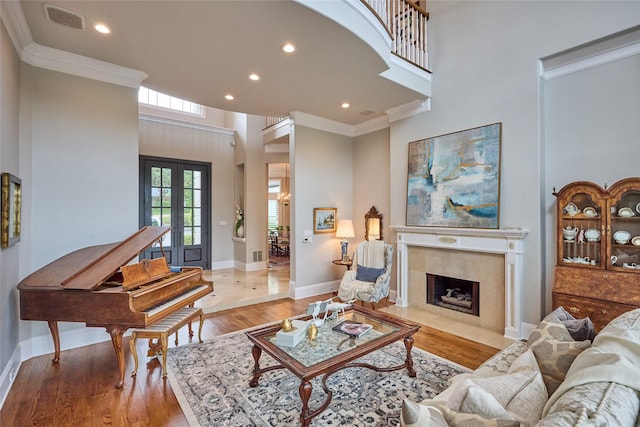 3 Savannah Ridge Dr, Frisco, TX 75034 - living area with crown molding, a high ceiling, recessed lighting, wood finished floors, and a fireplace