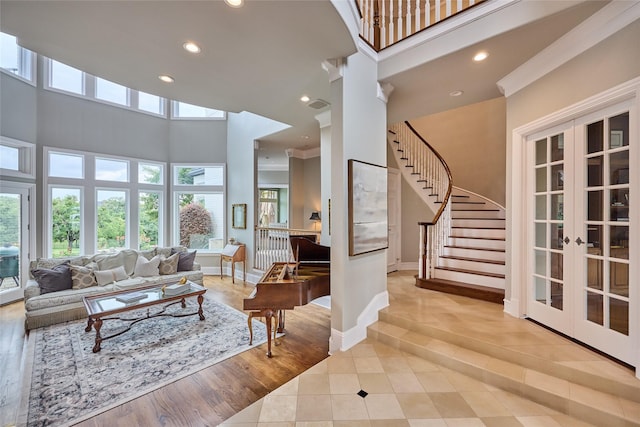 3 Savannah Ridge Dr, Frisco, TX 75034 - tiled living room with stairs, recessed lighting, french doors, a towering ceiling, and baseboards
