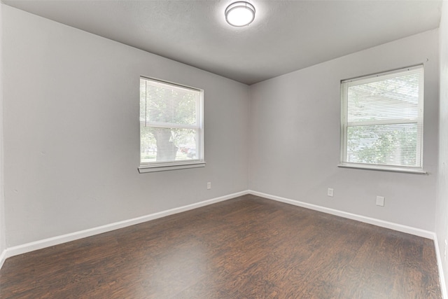 729 Grubb Cir, Mesquite, TX 75149 - unfurnished room featuring plenty of natural light, dark wood-type flooring, and baseboards