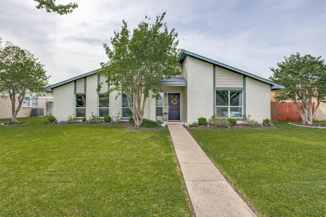 605 Sevilla Dr, Garland, TX 75043 - mid-century home with central AC unit and brick siding