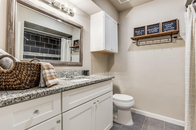 605 Sevilla Dr, Garland, TX 75043 - full bathroom with toilet, baseboards, tile patterned floors, vanity, and curtained shower