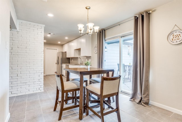 605 Sevilla Dr, Garland, TX 75043 - dining space with light tile patterned flooring, a chandelier, baseboards, and recessed lighting