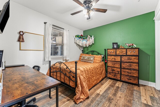179 Johnston Dr, Decatur, TX 76234 - bedroom with wood finished floors and ceiling fan