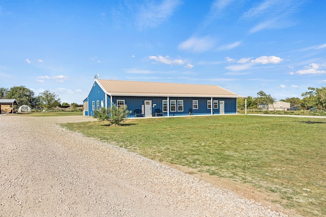 179 Johnston Dr, Decatur, TX 76234 - ranch-style house featuring a front yard, driveway, board and batten siding, and a garage