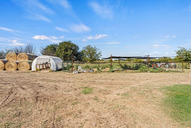 179 Johnston Dr, Decatur, TX 76234 - view of yard with a greenhouse, fence, and an outbuilding