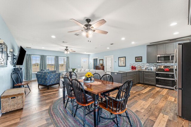 179 Johnston Dr, Decatur, TX 76234 - dining space featuring ceiling fan, wood finished floors, and recessed lighting