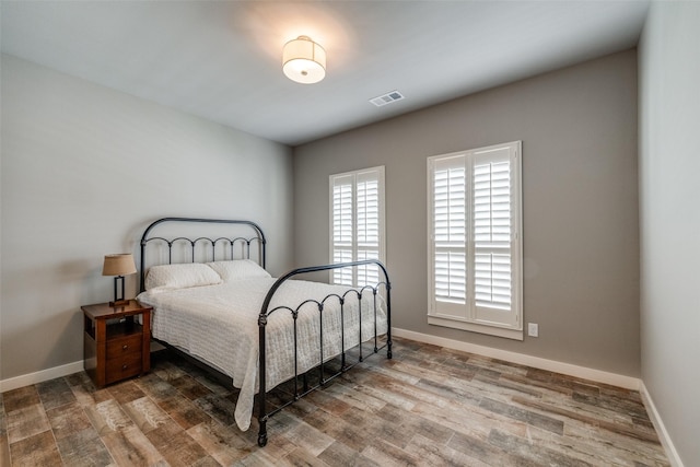 410 Phillips Ct, Mansfield, TX 76063 - bedroom featuring baseboards and wood finished floors