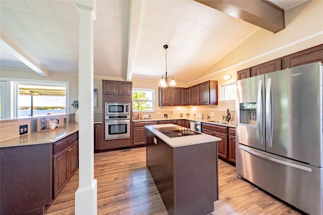 152 Pin Oak, Mabank, TX 75156 - kitchen with stainless steel appliances, tasteful backsplash, light wood-style floors, and a sink