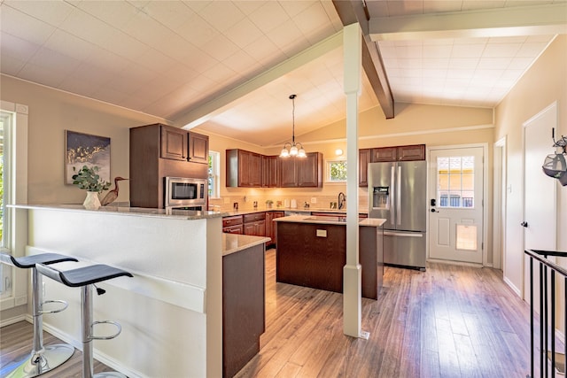 152 Pin Oak, Mabank, TX 75156 - kitchen featuring stainless steel appliances, light wood-type flooring, a sink, light countertops, and a chandelier