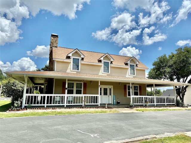 1407 Lady Amber Ln, Granbury, TX 76049 - farmhouse featuring a porch, a chimney, and a shingled roof