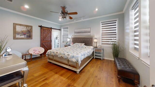 1407 Lady Amber Ln, Granbury, TX 76049 - bedroom featuring a barn door, wood finished floors, crown molding, recessed lighting, and ceiling fan