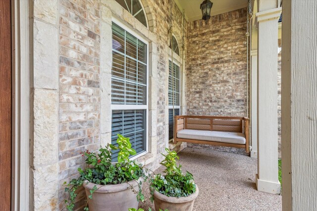 104 Lost Oaks Dr, Waco, TX 76705 - view of exterior entry featuring a porch, stone siding, and brick siding