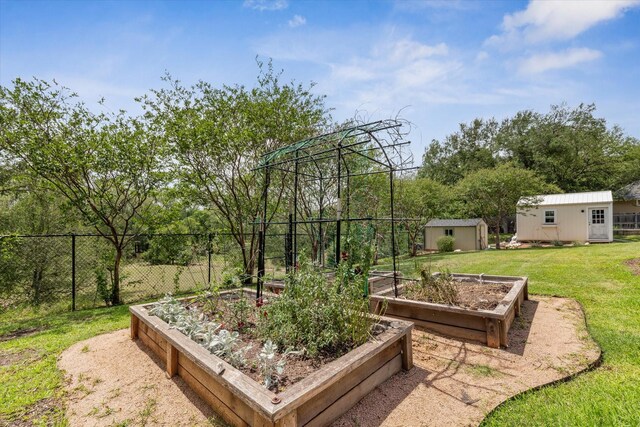 104 Lost Oaks Dr, Waco, TX 76705 - view of yard featuring a garden and an outbuilding