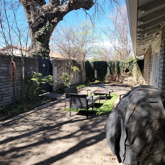 15642 Overmead Cir, Dallas, TX 75248 - view of patio with a fenced backyard and a fire pit