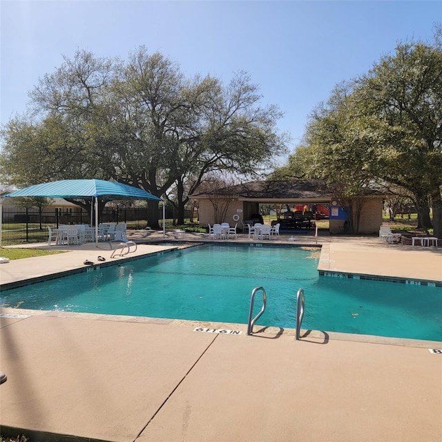 15642 Overmead Cir, Dallas, TX 75248 - community pool featuring a patio area and fence