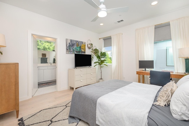 427 W 10th St Unit 803, Dallas, TX 75208 - bedroom with light wood-style flooring, recessed lighting, ensuite bathroom, and a ceiling fan