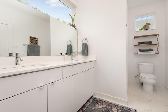 427 W 10th St Unit 803, Dallas, TX 75208 - bathroom featuring marble look tiles and double vanity
