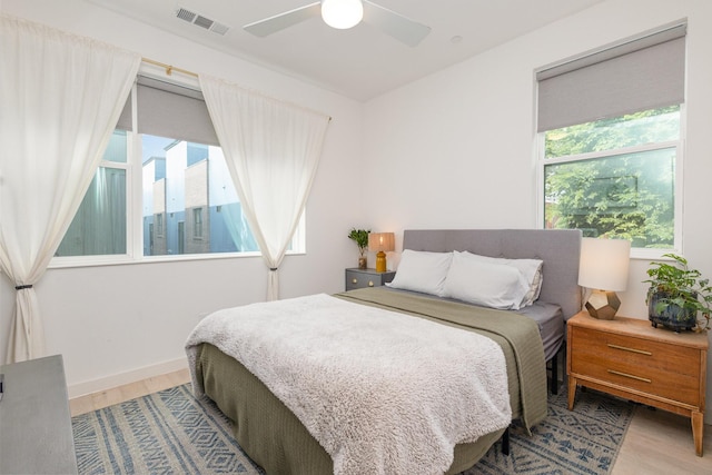 427 W 10th St Unit 803, Dallas, TX 75208 - bedroom with wood finished floors and ceiling fan
