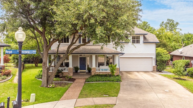 1928 Victoria Cir, Mckinney, TX 75072 - view of front of property featuring a porch, an attached garage, a front yard, driveway, and a shingled roof