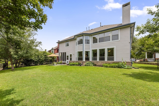 1928 Victoria Cir, Mckinney, TX 75072 - rear view of house featuring a chimney