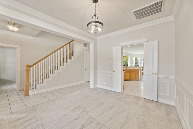 1928 Victoria Cir, Mckinney, TX 75072 - unfurnished room with light tile patterned floors, stairs, a decorative wall, crown molding, and light carpet