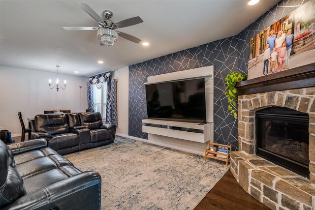 1822 Indigo Creek Ln, Wylie, TX 75098 - living area with a chandelier, an accent wall, recessed lighting, ceiling fan, and wood finished floors