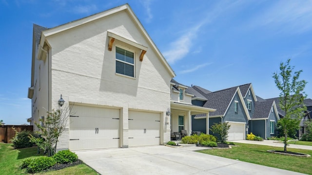 4190 Sandhills Ln, Prosper, TX 75078 - view of front of property with an attached garage, driveway, a front lawn, and brick siding