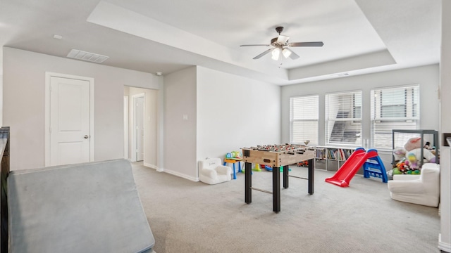 4190 Sandhills Ln, Prosper, TX 75078 - playroom with a tray ceiling, ceiling fan, carpet, and baseboards