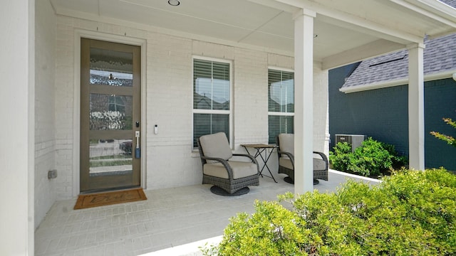 4190 Sandhills Ln, Prosper, TX 75078 - view of exterior entry featuring a porch, brick siding, and a shingled roof