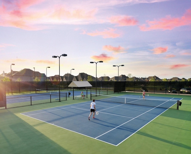 4190 Sandhills Ln, Prosper, TX 75078 - view of tennis court with fence, community basketball court, and a residential view