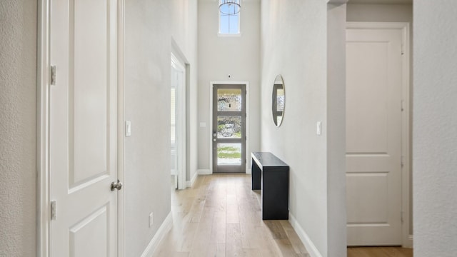 4190 Sandhills Ln, Prosper, TX 75078 - entrance foyer with light wood-type flooring and baseboards