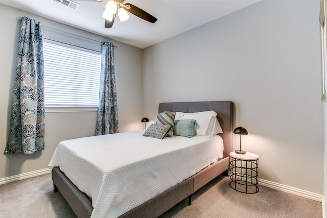 bedroom with carpet floors, baseboards, and ceiling fan