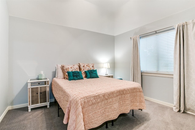 carpeted bedroom with baseboards