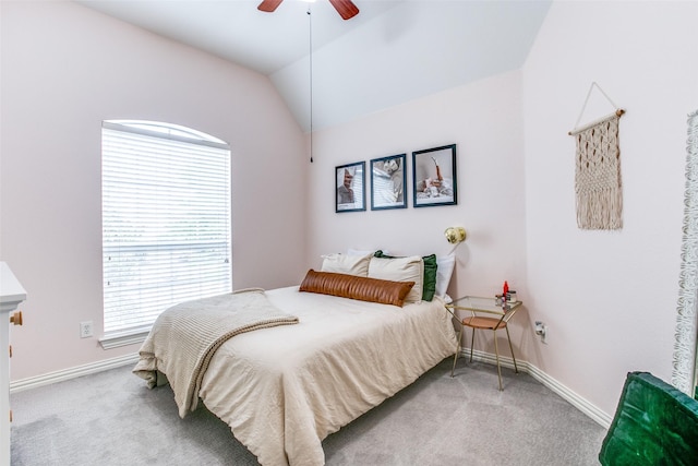 bedroom with carpet floors, baseboards, vaulted ceiling, and ceiling fan