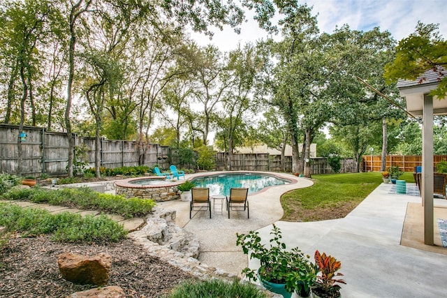 view of pool featuring a patio area and a pool with connected hot tub