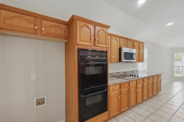 301 Angela Dr, Burleson, TX 76028 - kitchen with black appliances, light stone counters, light tile patterned flooring, baseboards, and recessed lighting