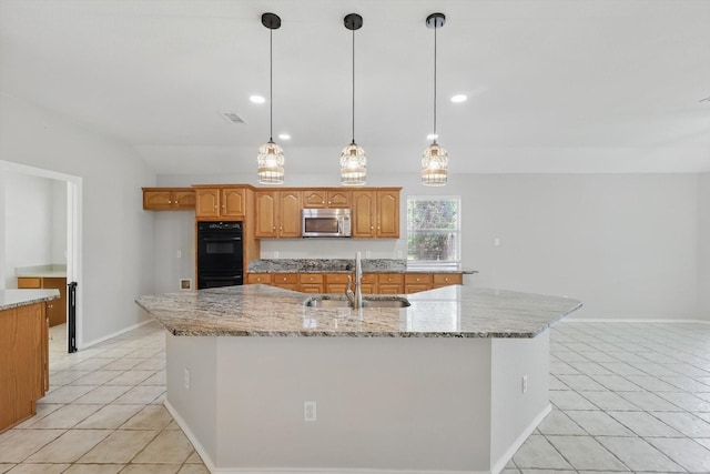301 Angela Dr, Burleson, TX 76028 - kitchen featuring stainless steel microwave, a sink, light tile patterned floors, a large island, and lofted ceiling