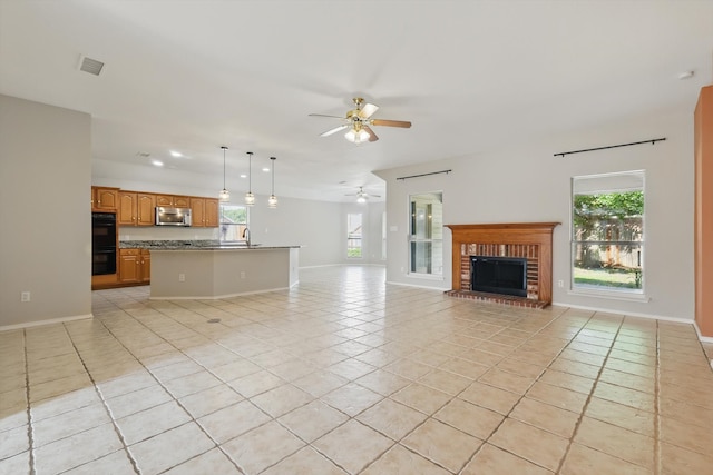 301 Angela Dr, Burleson, TX 76028 - unfurnished living room featuring light tile patterned floors, a ceiling fan, a fireplace, and baseboards