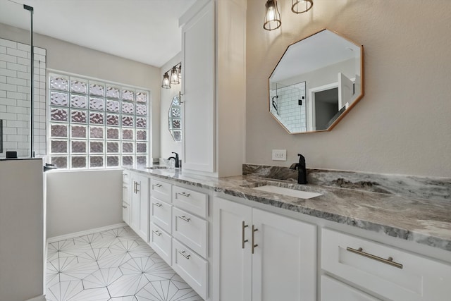 301 Angela Dr, Burleson, TX 76028 - bathroom featuring double vanity, baseboards, and a shower