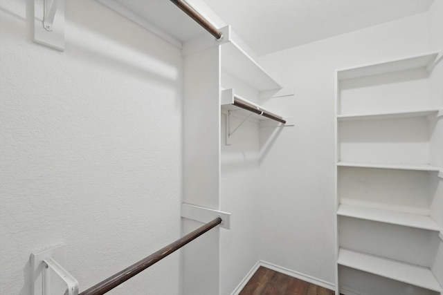 301 Angela Dr, Burleson, TX 76028 - walk in closet with dark wood finished floors