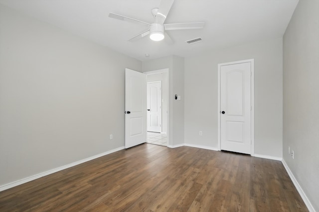 301 Angela Dr, Burleson, TX 76028 - unfurnished bedroom with dark wood-type flooring, baseboards, and ceiling fan