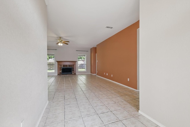 301 Angela Dr, Burleson, TX 76028 - unfurnished living room featuring light tile patterned floors, a ceiling fan, a fireplace, and baseboards