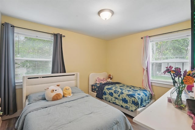 4507 Hyde Park Dr, Mesquite, TX 75150 - bedroom with multiple windows and wood finished floors