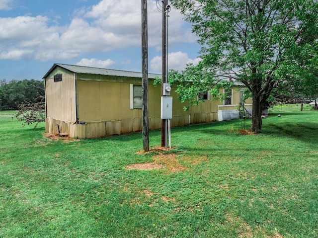 14581 Texas Highway 11 E, Pickton, TX 75471 - view of property exterior with a yard and metal roof