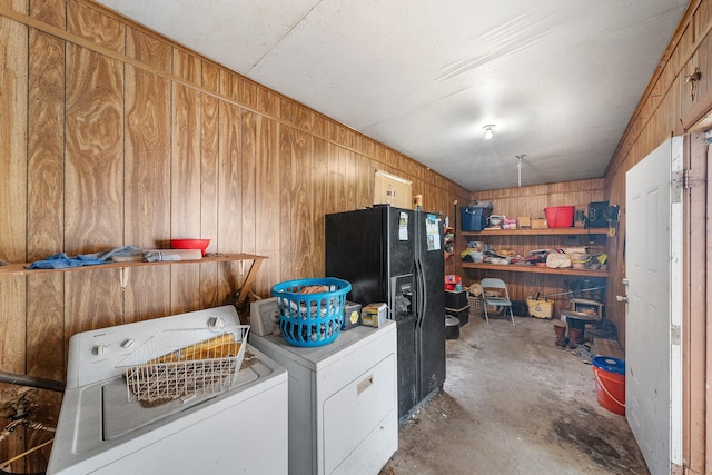 14581 Texas Highway 11 E, Pickton, TX 75471 - clothes washing area with independent washer and dryer and wooden walls
