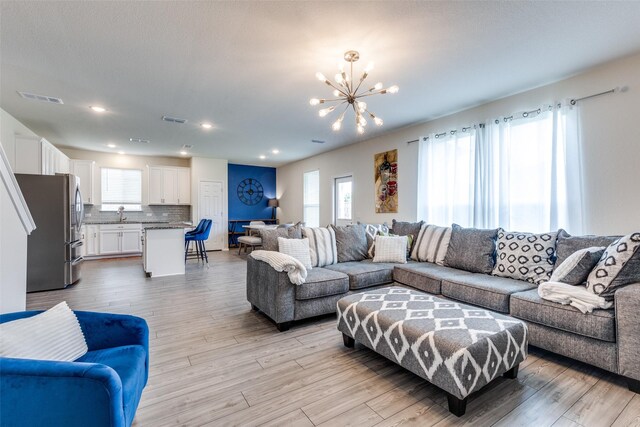 5616 Apple Grove Way, Fort Worth, TX 76123 - living area with a chandelier, light wood-type flooring, and recessed lighting