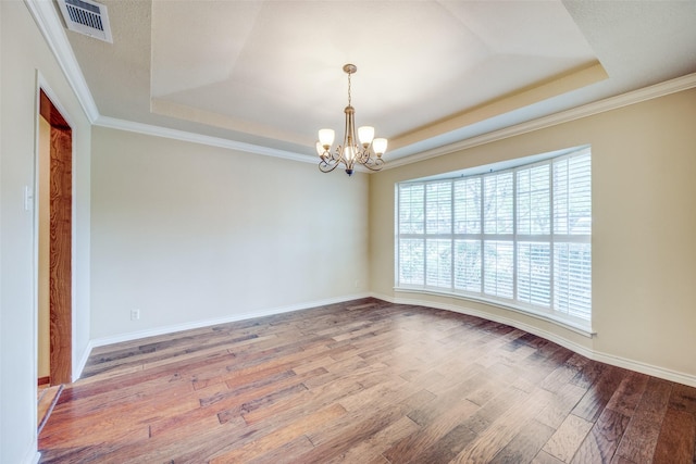 2500 Shoreline Dr, Sherman, TX 75092 - spare room with a tray ceiling, healthy amount of natural light, a chandelier, and ornamental molding
