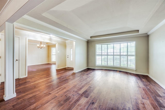 2500 Shoreline Dr, Sherman, TX 75092 - empty room with a tray ceiling, a chandelier, dark wood finished floors, ornamental molding, and baseboards