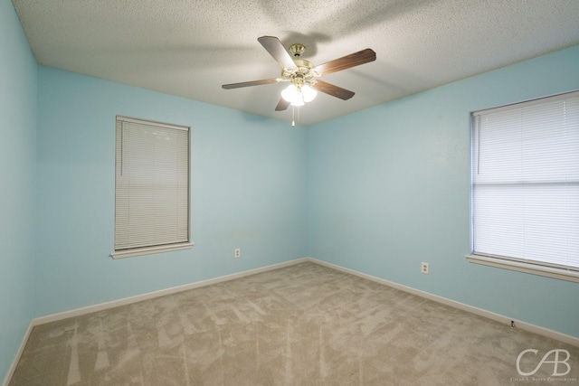 4417 Pamela Dr, Abilene, TX 79606 - empty room with carpet, ceiling fan, baseboards, and a textured ceiling