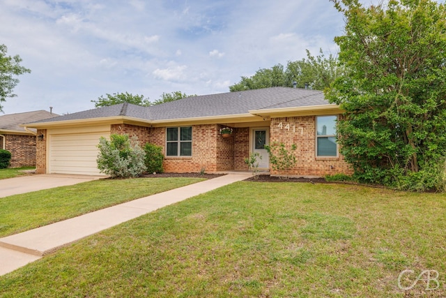 4417 Pamela Dr, Abilene, TX 79606 - ranch-style home featuring brick siding, an attached garage, driveway, and a front yard